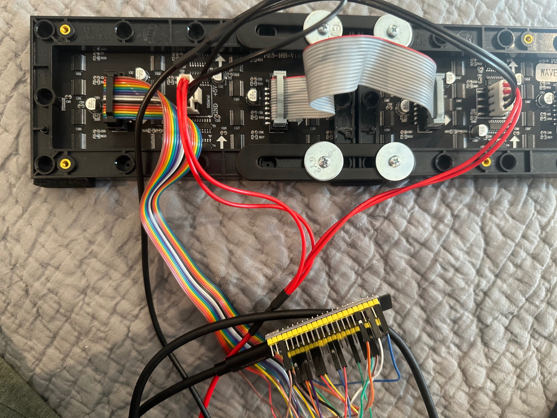 Rear of panels with ribbon cables and jumper wiring